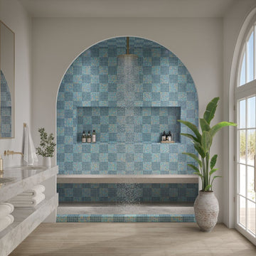 Modern bathroom with blue mosaic tile wall and large window