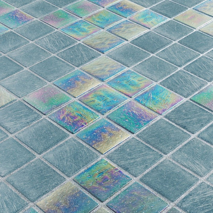 Close-up of iridescent glass mosaic tiles in a grid pattern