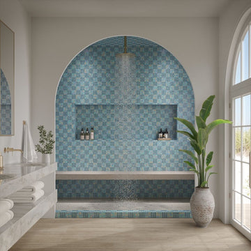 Modern bathroom with blue mosaic tile wall and large window