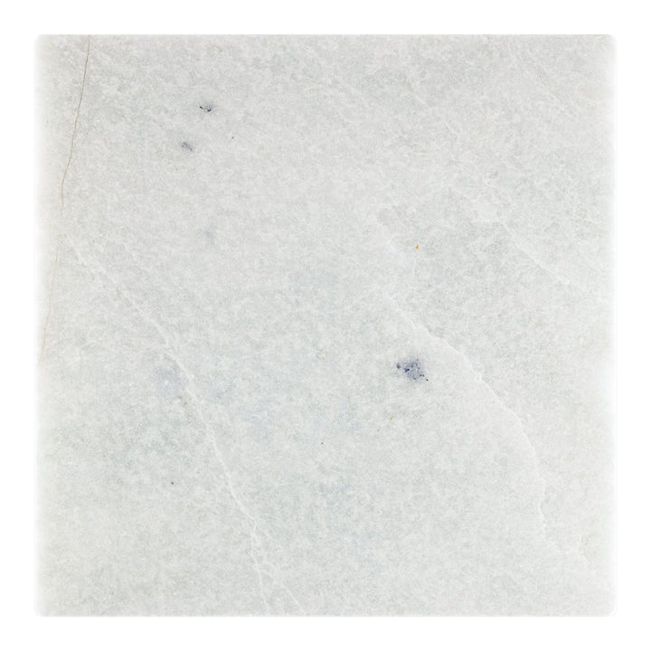 Ming Green Tumbled Marble Tile with chair and plant