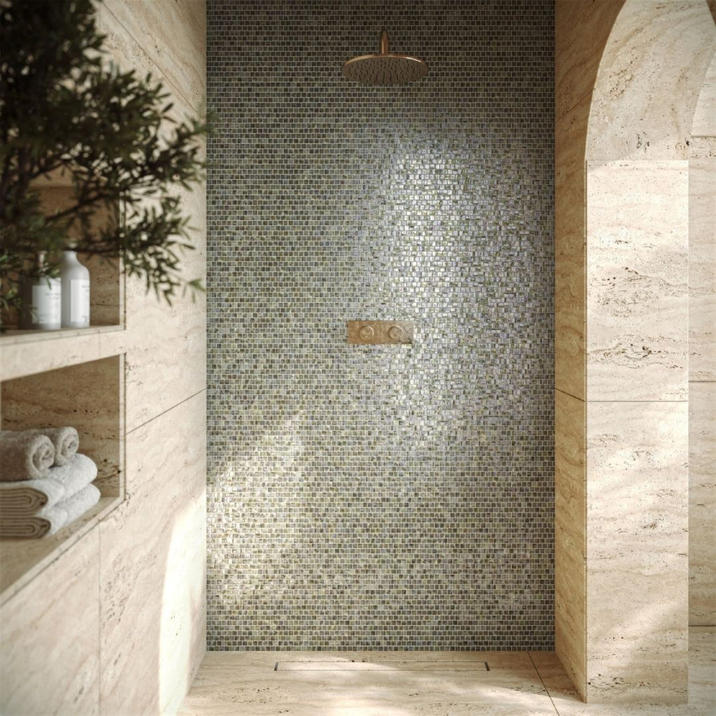 Foxtrot Iridescent, 5/8" x 5/8" Glass Mosaic Tile with a shower head, plant, towels and soaps