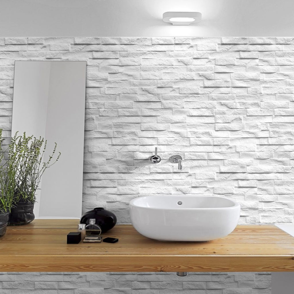 Rock White 3" x 15" Ledgerstone Tile with sink and mirror with plant