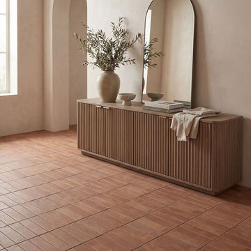 Terracotta Subway Stack Porcelain Tile with a credenza, books, plant and mirror