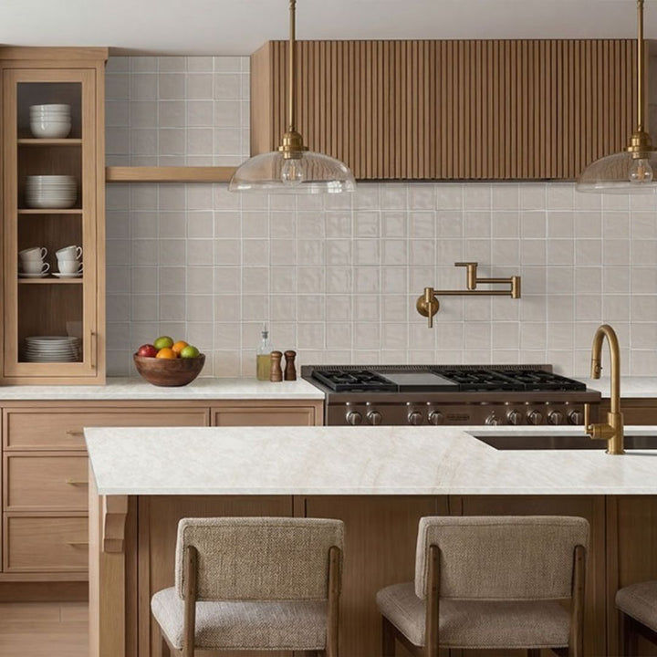 Terranello Ivory 4" x 4" Glossy Kitchen Backsplash Tile with chairs, lamps and stove.