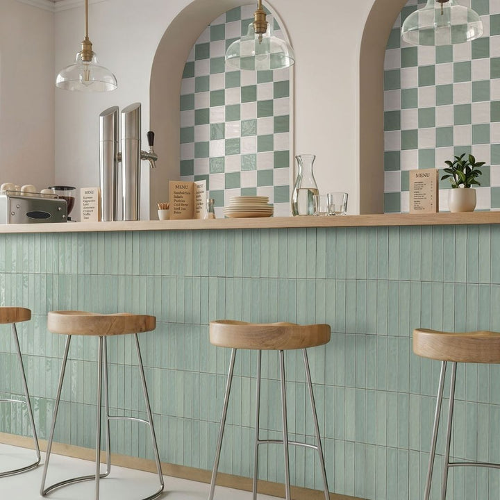 Terranello Olive 4" x 4" Glossy Kitchen & Bathroom Tile with  lamps, barstools, menu, plates and small plant