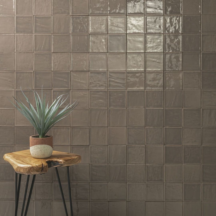 Terranello Umber 4" x 4" Glossy Kitchen & Bathroom Tile with a small table and plant