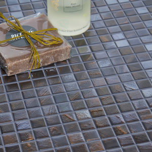 Black and metallic 1" x 1" glass tile on shower floor