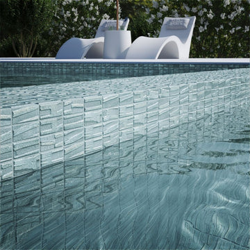 silver mosaic glass tile on pool waterline