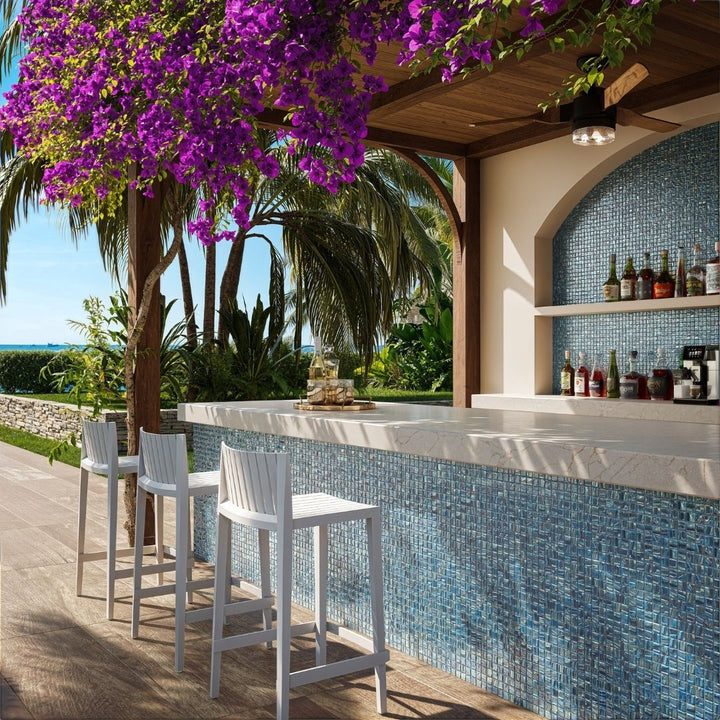 blue mosaic glass tile in outdoor and kitchen and bar area with barstools