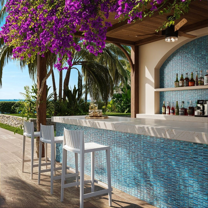 blue mosaic glass tile in outdoor and kitchen and bar area with barstools