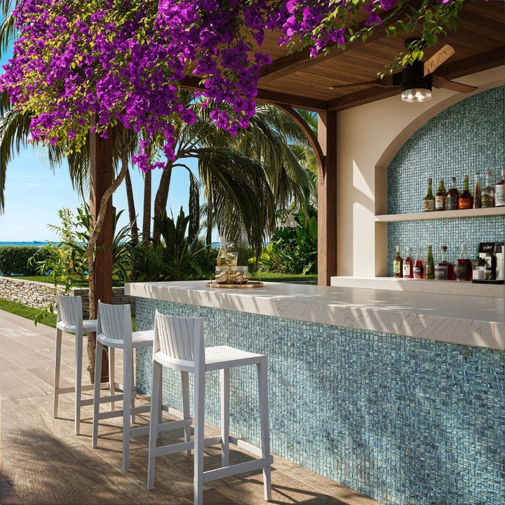 silver mosaic glass tile in outdoor and kitchen and bar area with barstools