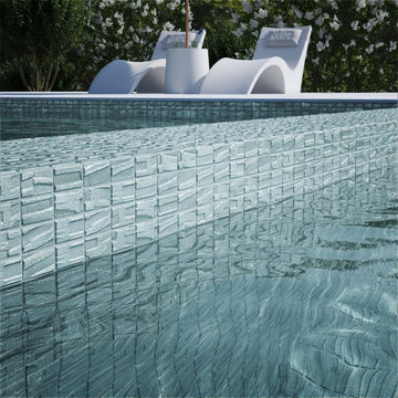 silver mosaic glass tile on pool waterline
