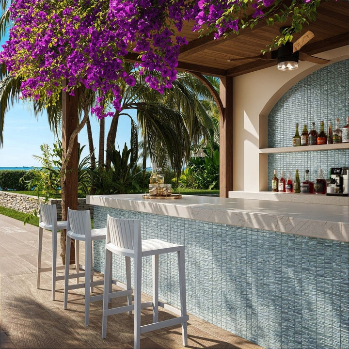 silver mosaic glass tile in outdoor and kitchen and bar area with barstools