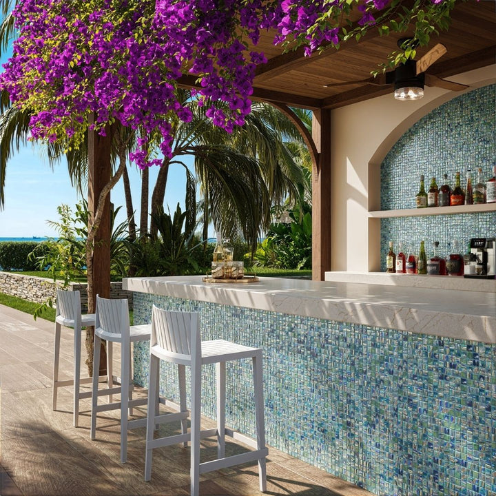 green mosaic glass tile in outdoor and kitchen and bar area with barstools
