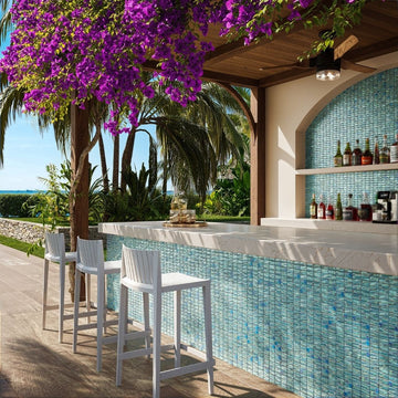 green mosaic glass tile in outdoor and kitchen and bar area with barstools