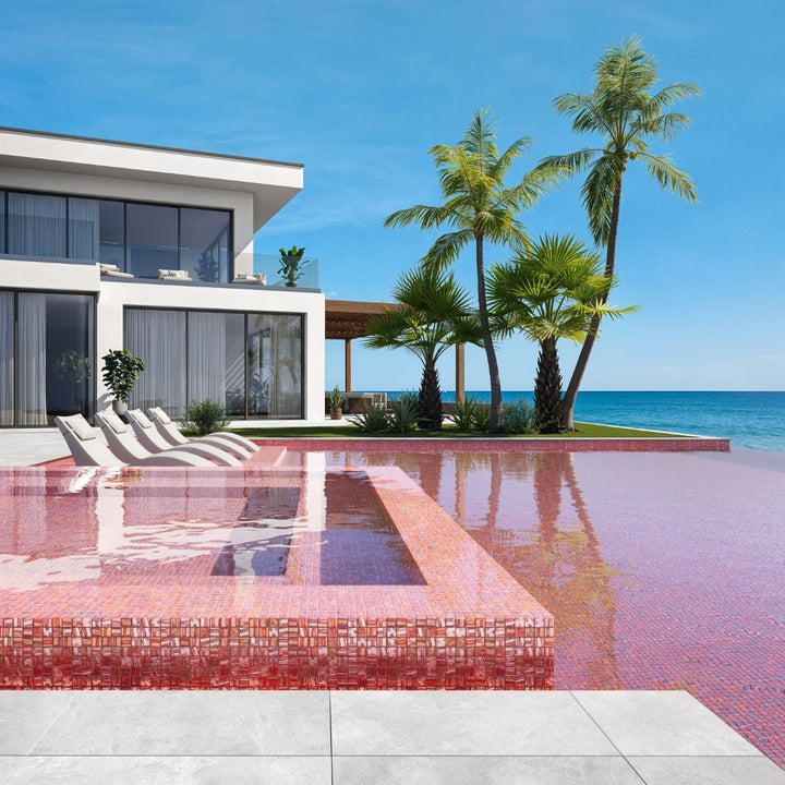 red mosaic glass tile in swimming pool with chairs and palm trees