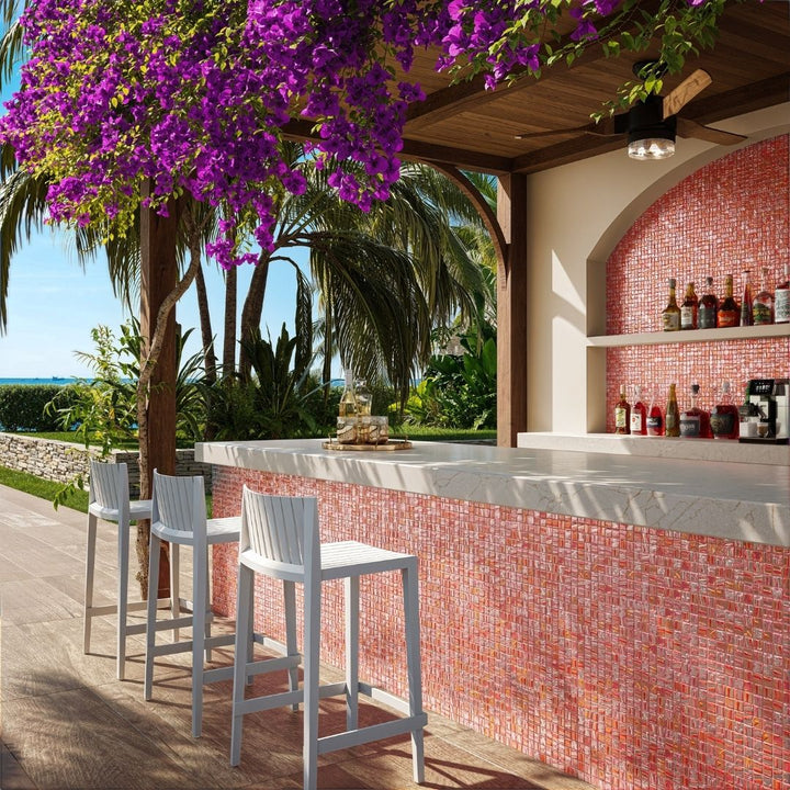 red mosaic glass tile in outdoor and kitchen and bar area with barstools