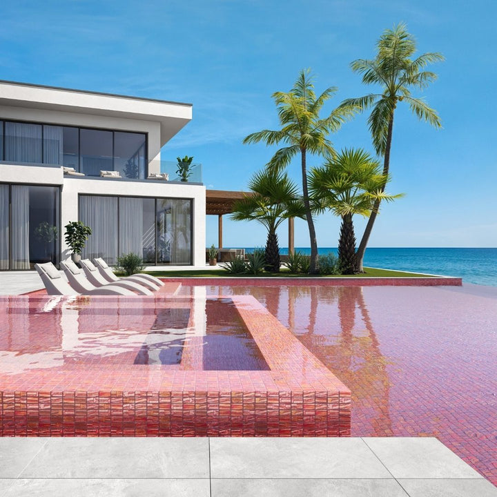 red mosaic glass tile in swimming pool with chairs and palm trees