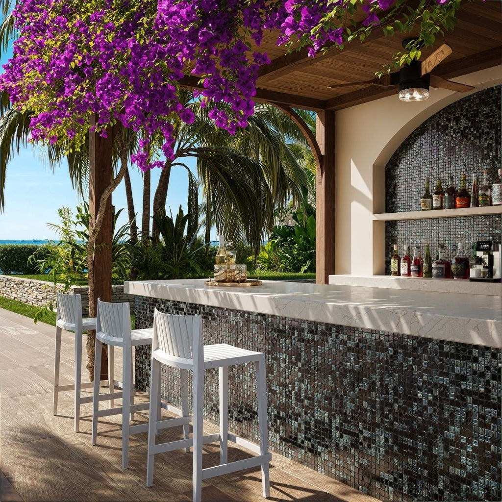 black mosaic glass tile in outdoor and kitchen and bar area with barstools