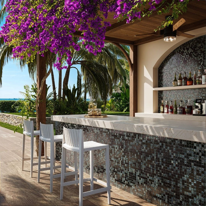 black mosaic glass tile in outdoor and kitchen and bar area with barstools