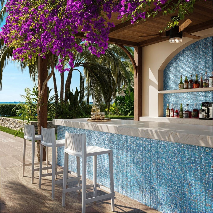 blue mosaic glass tile in outdoor and kitchen and bar area with barstools