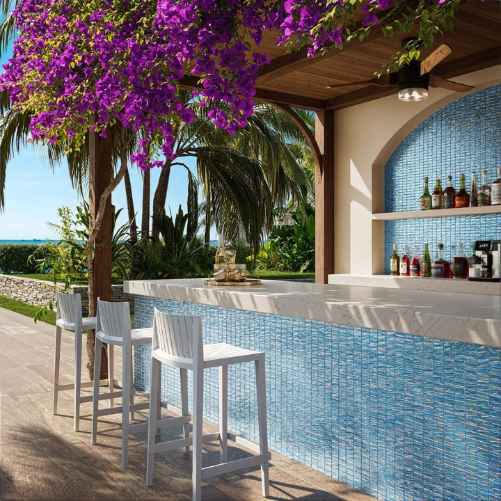 blue mosaic glass tile in outdoor and kitchen and bar area with barstools