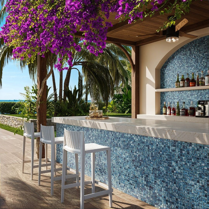 blue mosaic glass tile in outdoor and kitchen and bar area with barstools