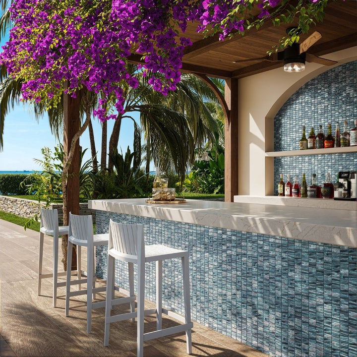 blue mosaic glass tile in outdoor and kitchen and bar area with barstools