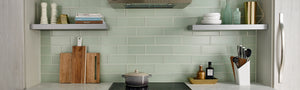 Light green glass subway tile on kitchen backsplash